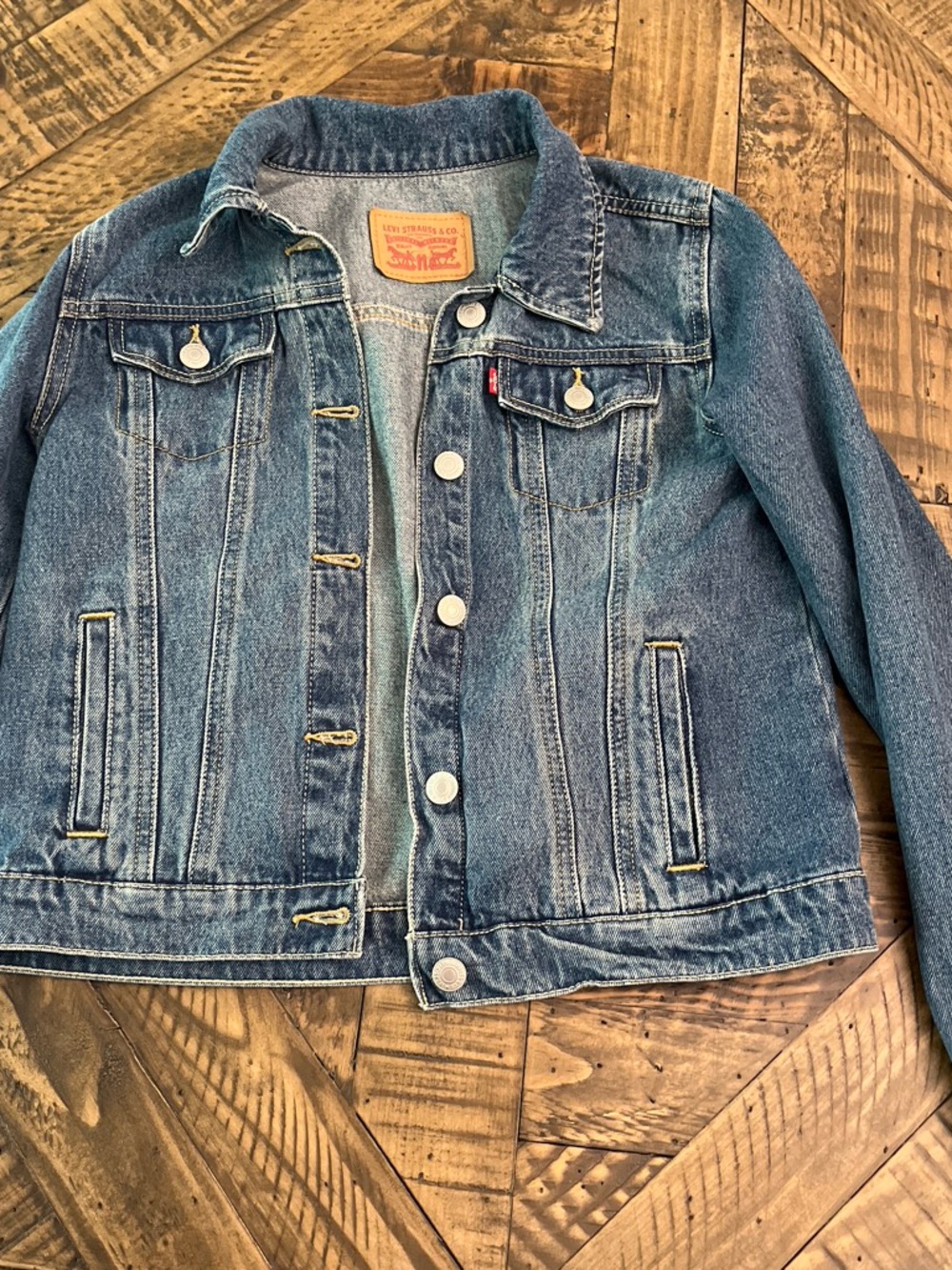 Levi's light blue denim jacket with tan leather patch